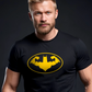 Muscular man wearing Batman inspired fitness themed black t-shirt showing the yellow silhouette of the hero doing a front double bicep pose inside a yellow outlined oval. 